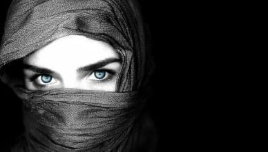 Veiled-Woman-Face-with-Blue-Eyes-600x342